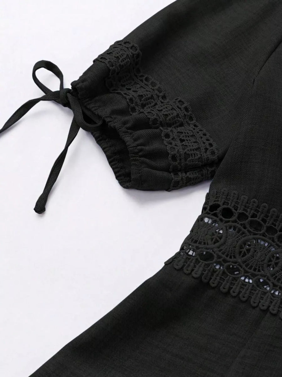 Black mini dress with lace trim and tie sleeves