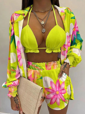 Floral print two-piece outfit set in chartreuse with frill trim bikini top and shorts.