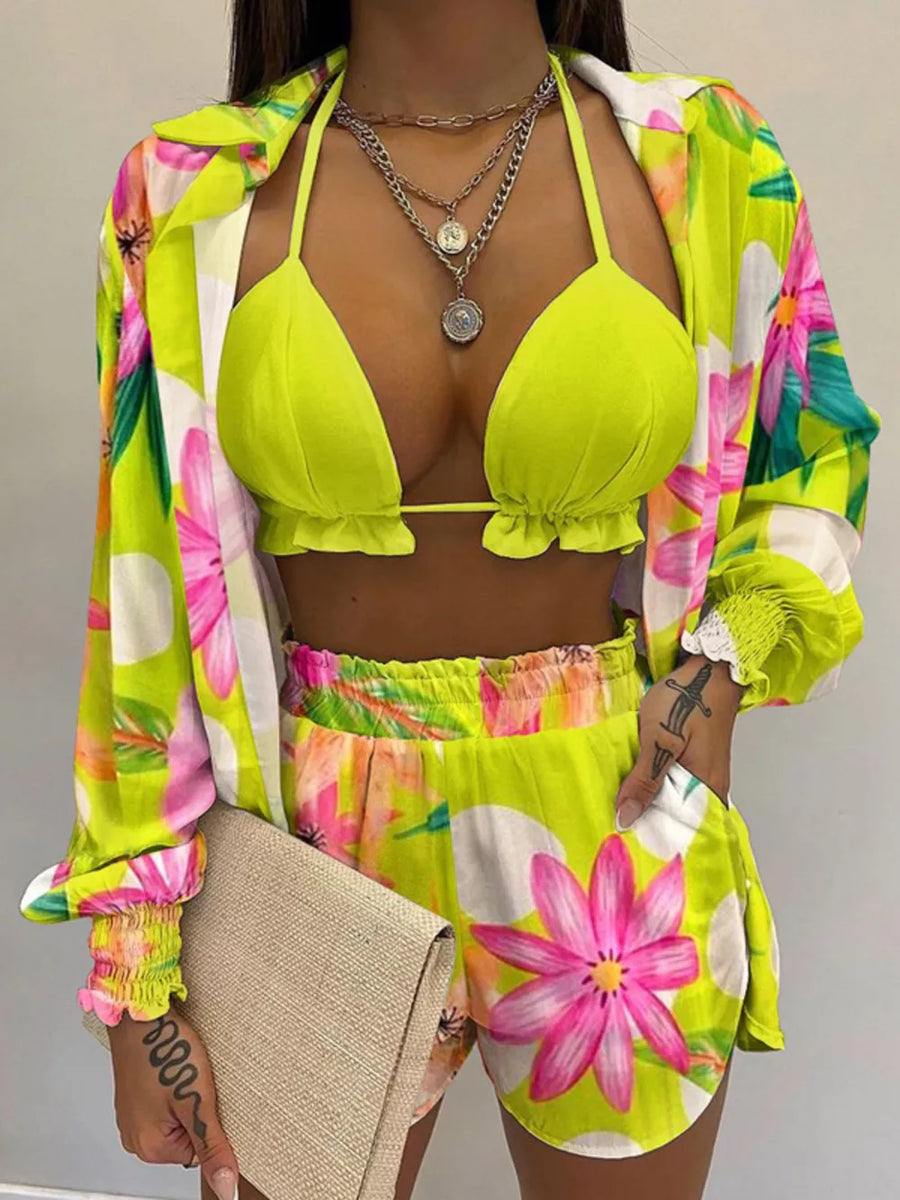 Floral print two-piece outfit set in chartreuse with frill trim bikini top and shorts.