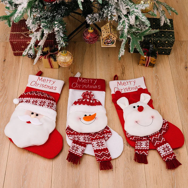 Three whimsical holiday stockings: Santa, snowman, and reindeer designs, all red and white with Merry Christmas text.