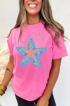 Pink t-shirt with a blue starfish graphic filled with colorful flowers