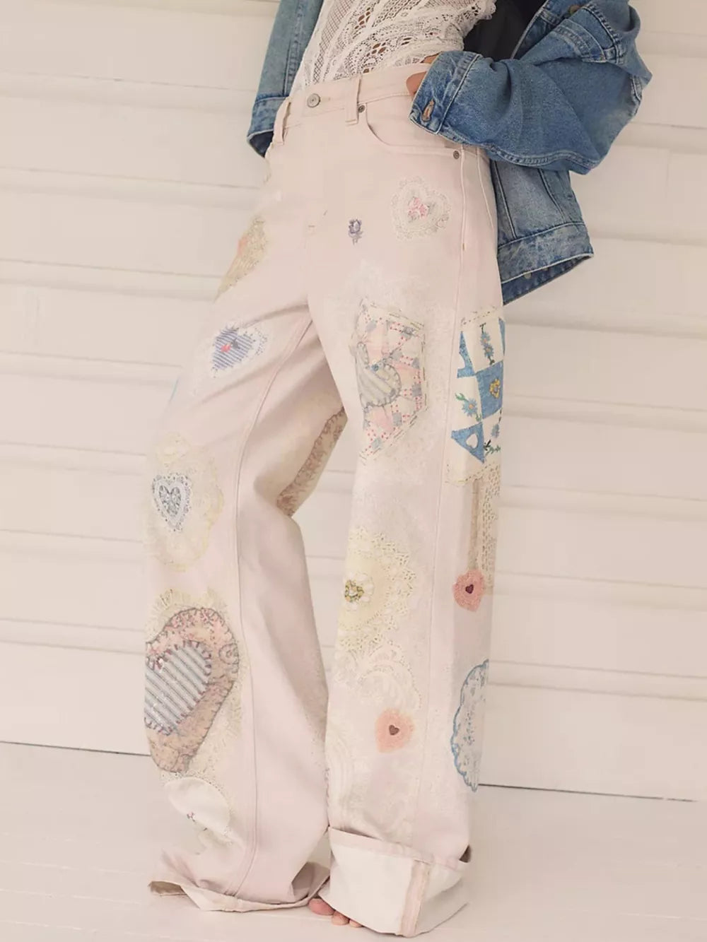 light blue wide-leg jeans featuring high-waisted and mixed-motif print