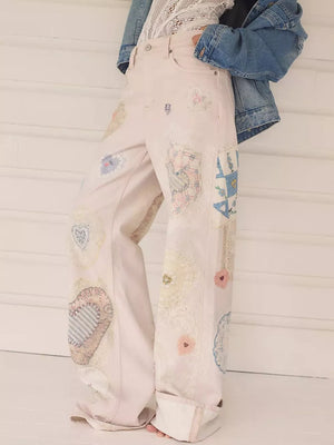 light blue wide-leg jeans featuring high-waisted and mixed-motif print