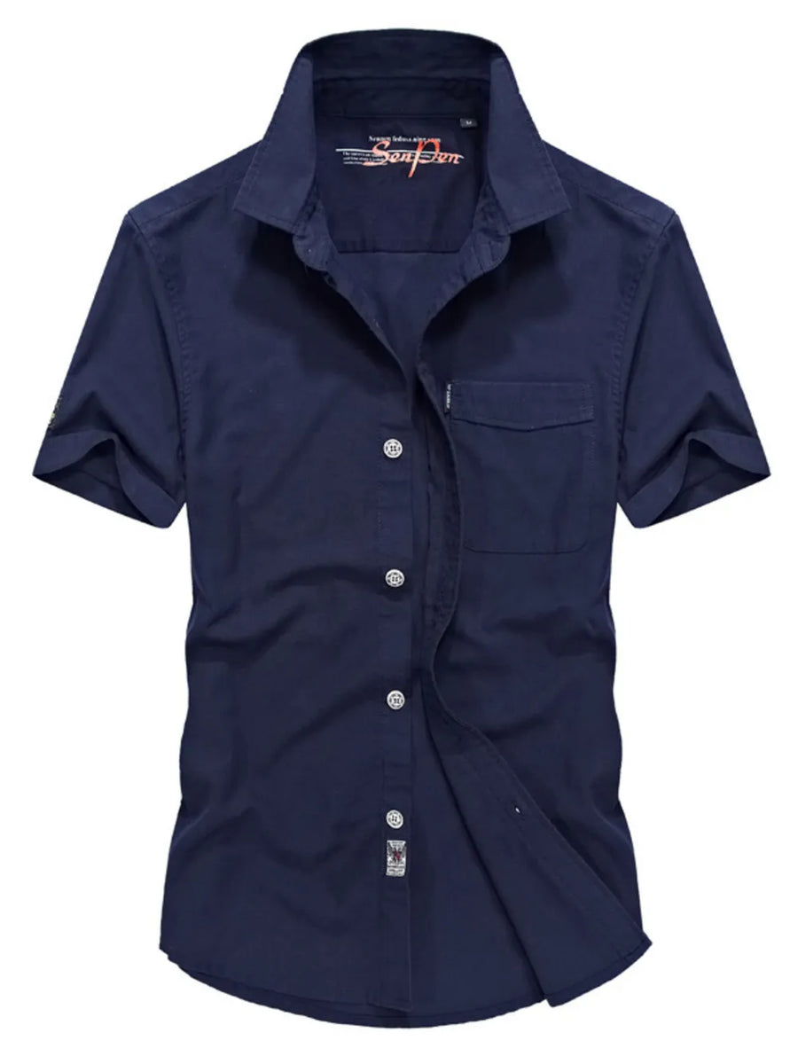 Men's dark blue short sleeve button-down shirt with pocket and cotton fabric.