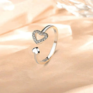 Open heart pavé ring in silver with a smaller heart accent.