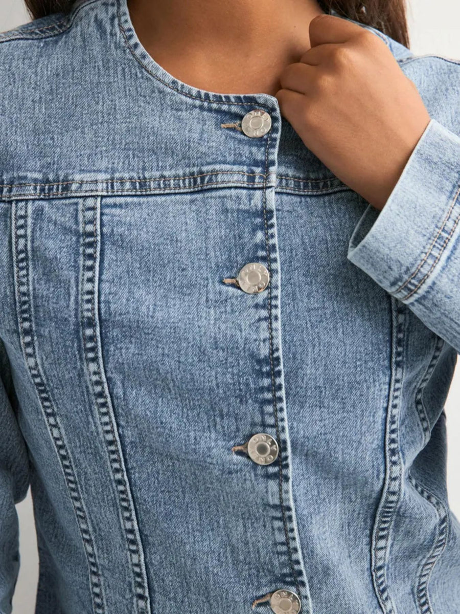 Button-down denim jacket with seam detailing and a collarless neckline.