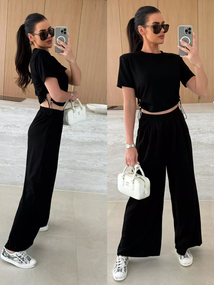 Black crop top with drawstring sides and wide-leg pants set.