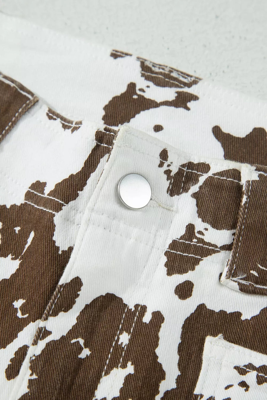 white jeans featuring pocketed and abstract