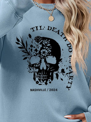 Air Force Blue raglan sweatshirt with floral skull graphic and text.