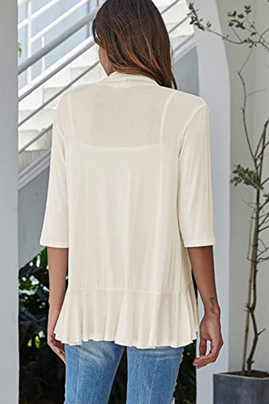 Cream asymmetrical ruffle hem cardigan with 3/4 sleeves.