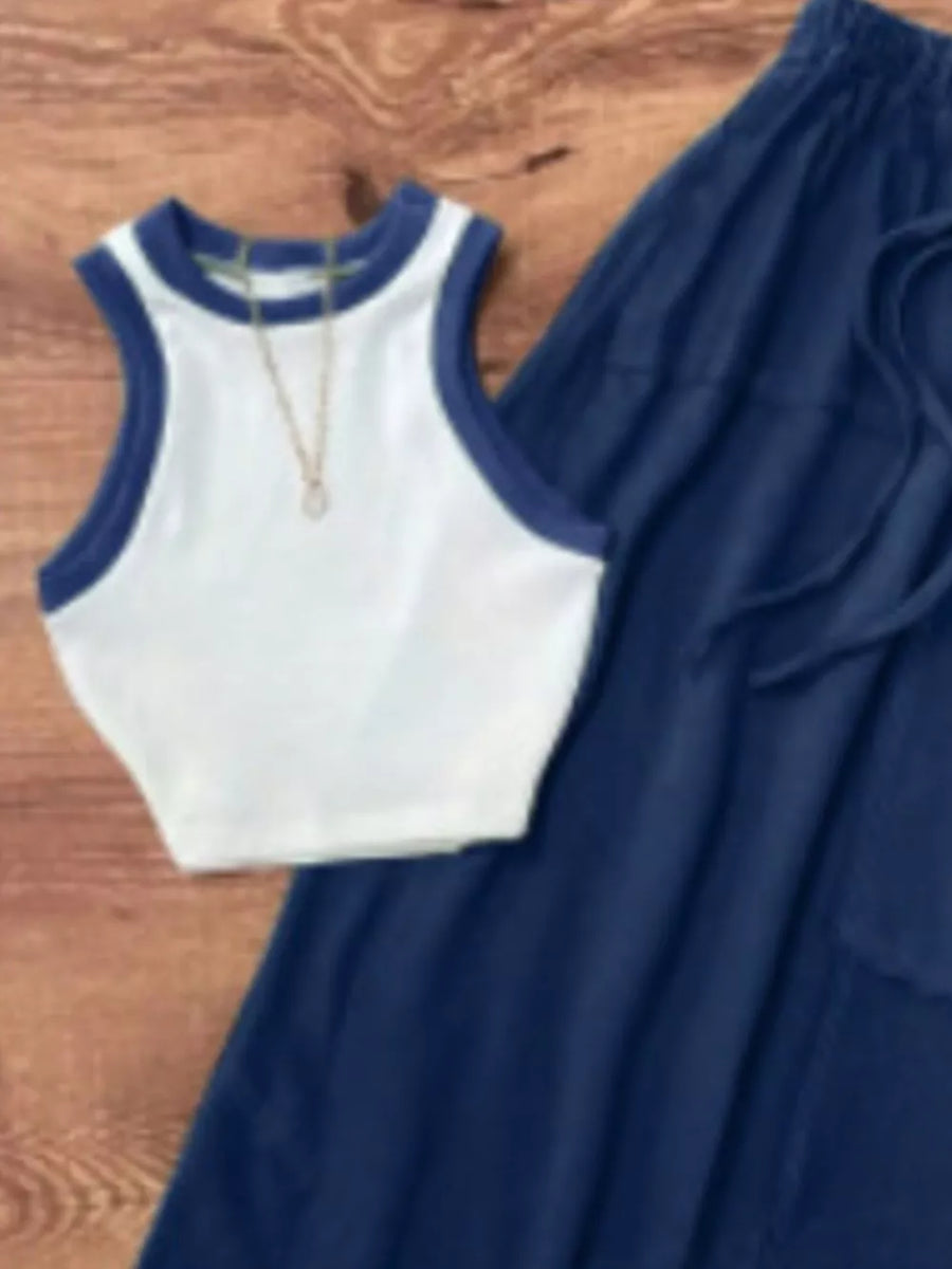 White cropped tank top with navy trim and navy drawstring pants