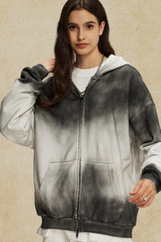Ombre washed zip-up hoodie in black and white with a front pocket and distressed details.
