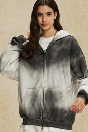 Ombre washed zip-up hoodie in black and white with a front pocket and distressed details.