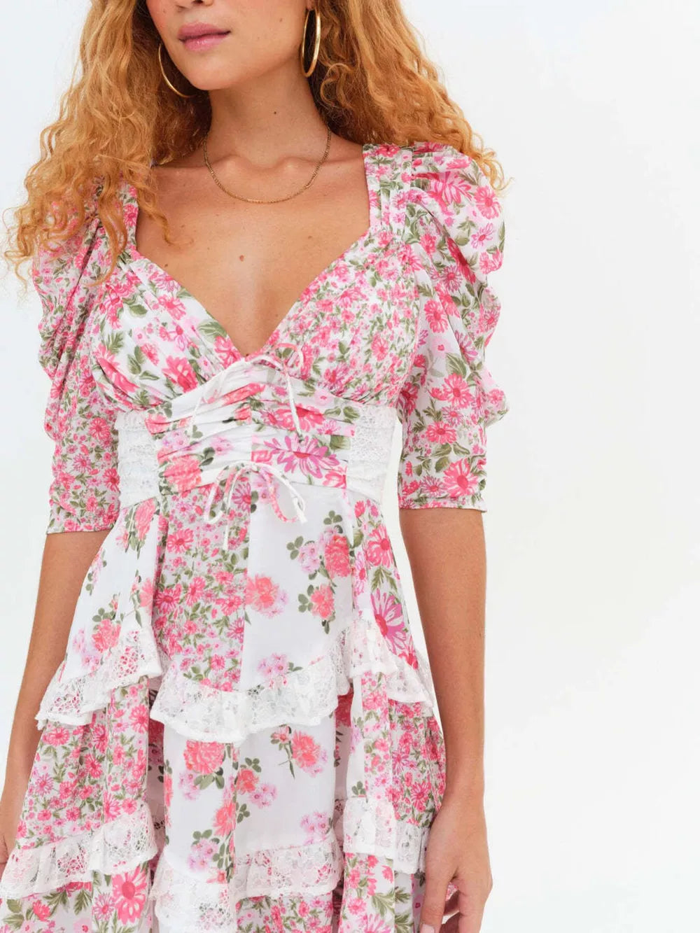 Ruched floral tie-front dress with lace trim and half sleeves.