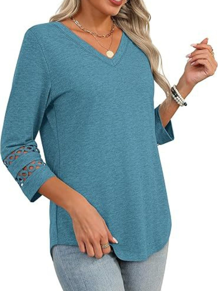 Blue 3/4 sleeve t-shirt with V-neck and cutout detail on sleeves.