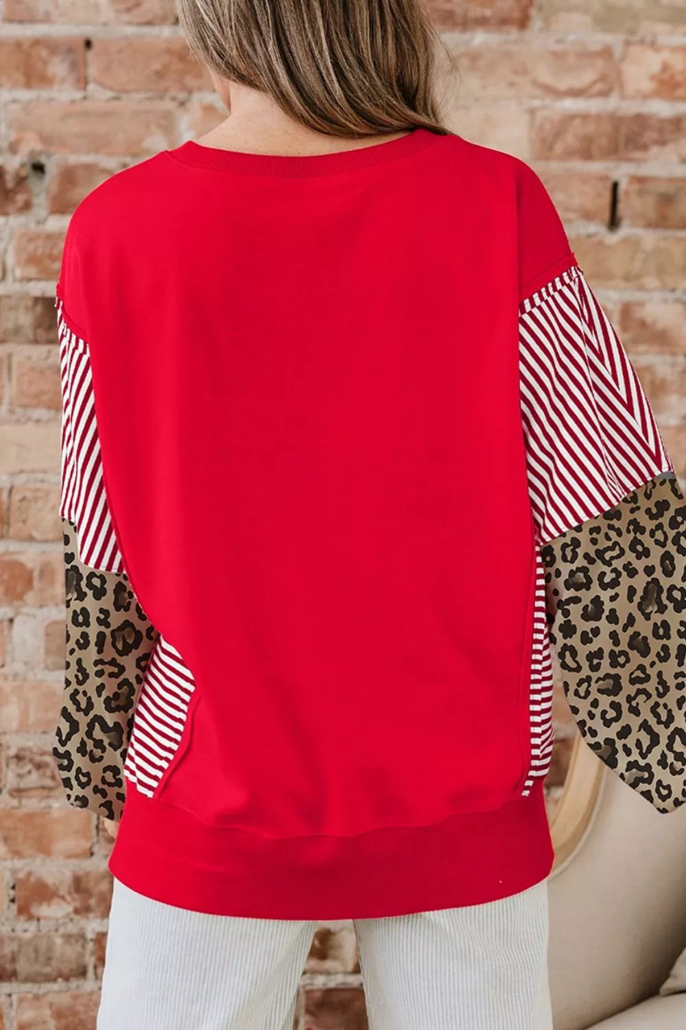 100% polyester Care instructions: Machine wash cold sweatshirt in white with relaxed silhouette