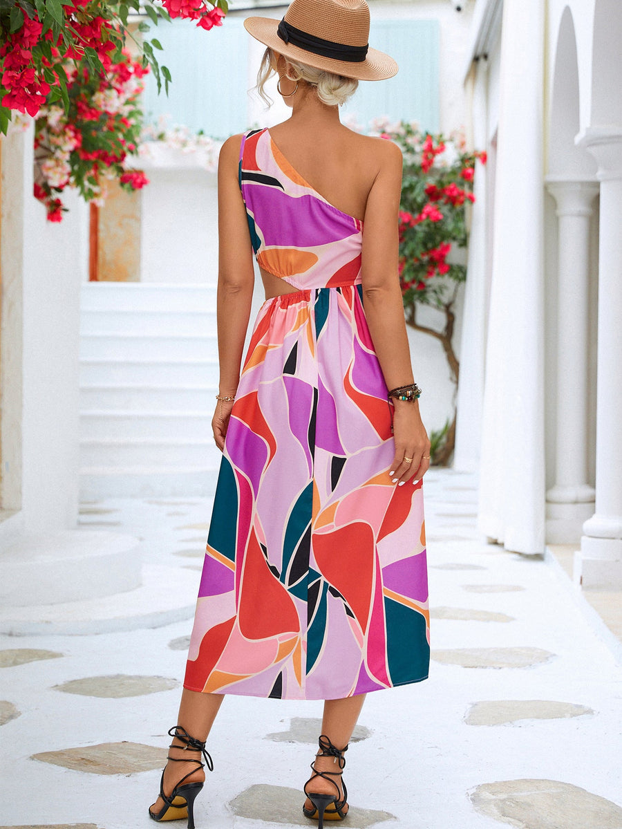 Abstract cutout midi dress with one-shoulder design and geometric print in magenta and blue tones.