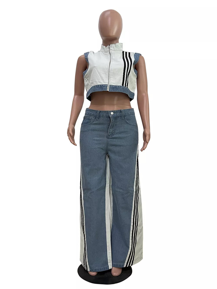 White zip-front crop top with black stripes and wide-leg jeans with side stripe detail.