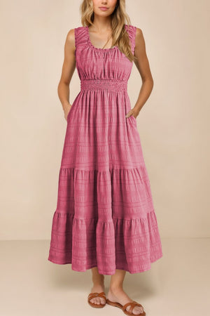 Deep rose smocked midi dress with tiered skirt and pockets.