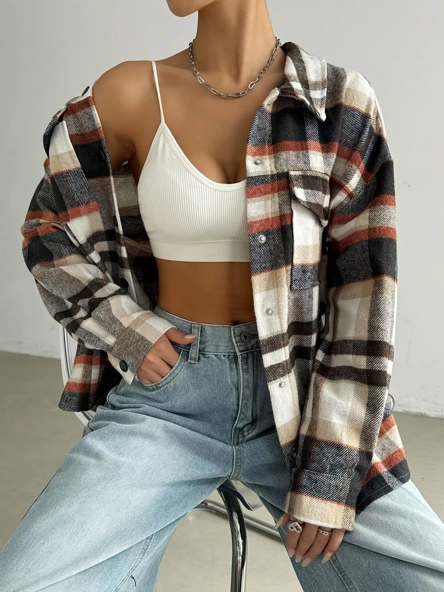Relaxed fit plaid shirt jacket in mocha with button front and chest pockets.