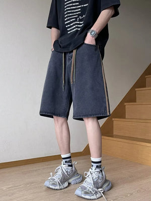 Men's black wide-leg denim shorts with drawstring and side stripe detail