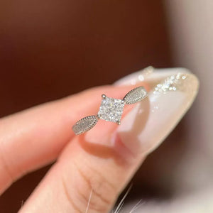 Moissanite geometric sterling silver ring with textured band detail.