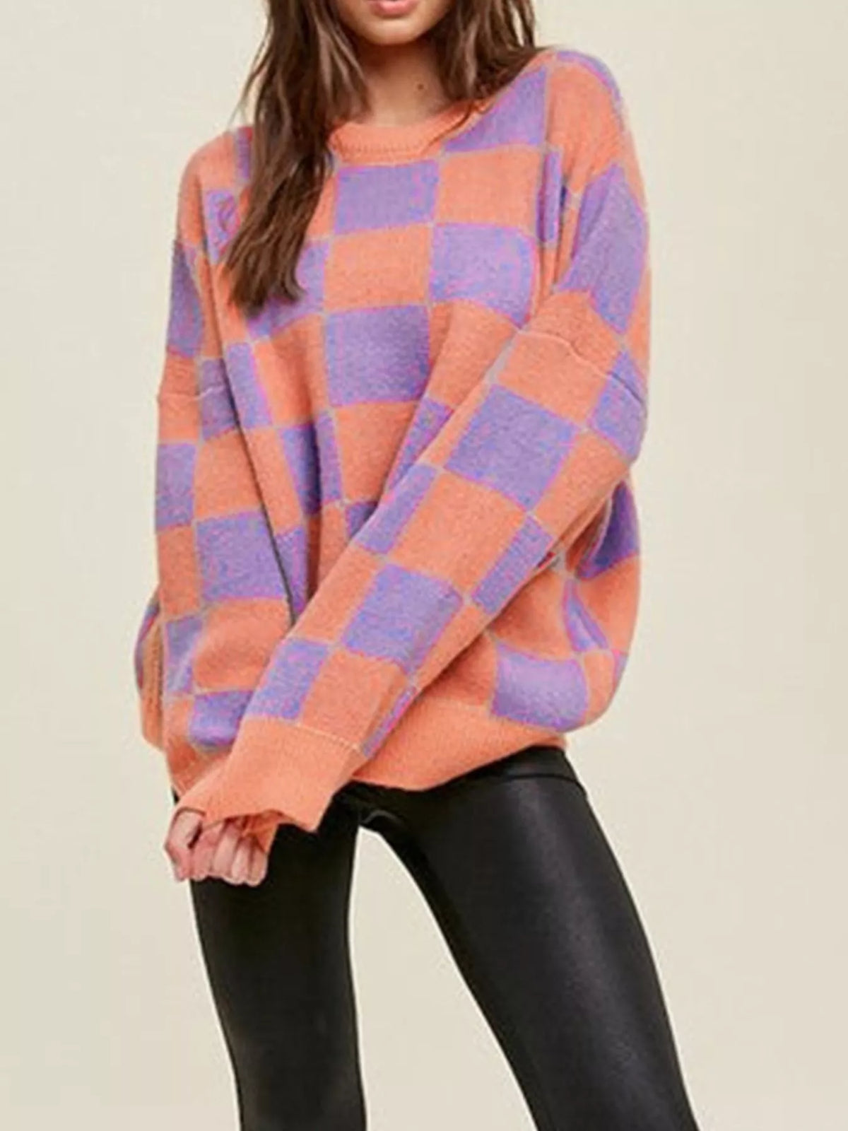 Chic checkerboard knit sweater in multicolor with crew neck and long sleeves.