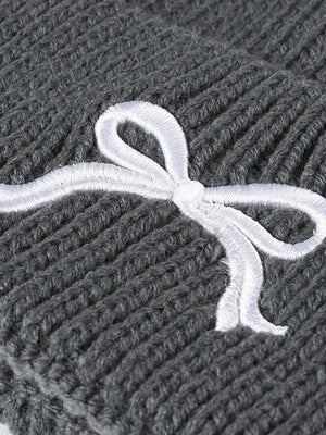 Gray ribbed knit beanie with embroidered white bow detail