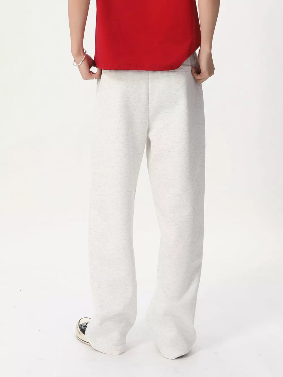 Men's gray cotton wide-leg drawstring sweatpants with a relaxed fit.