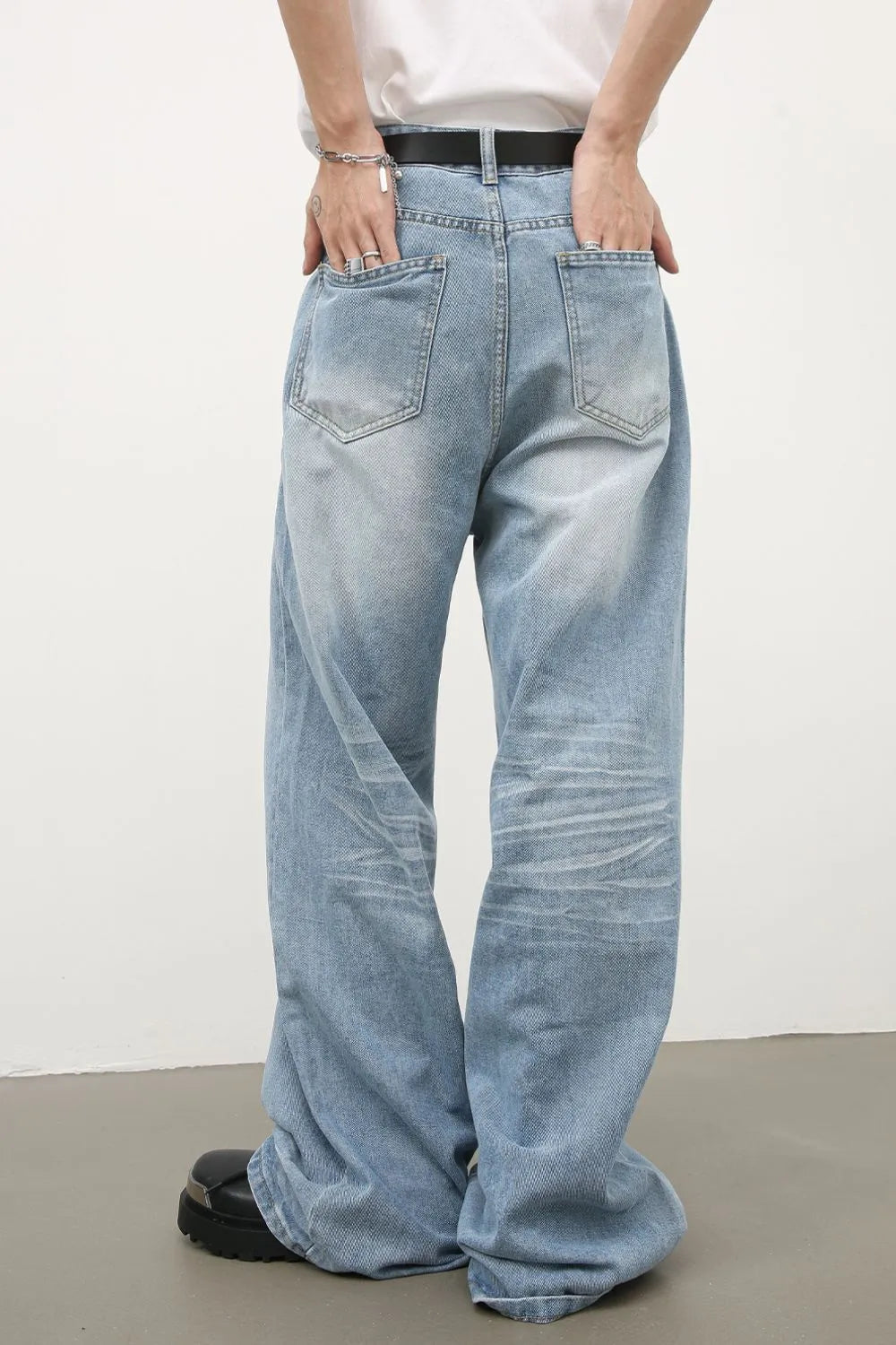 Baggy light blue denim palazzo jeans with a relaxed fit and distressed details.