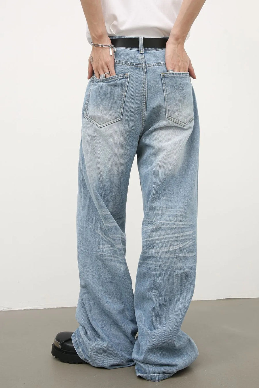 Baggy light blue denim palazzo jeans with a relaxed fit and distressed details.