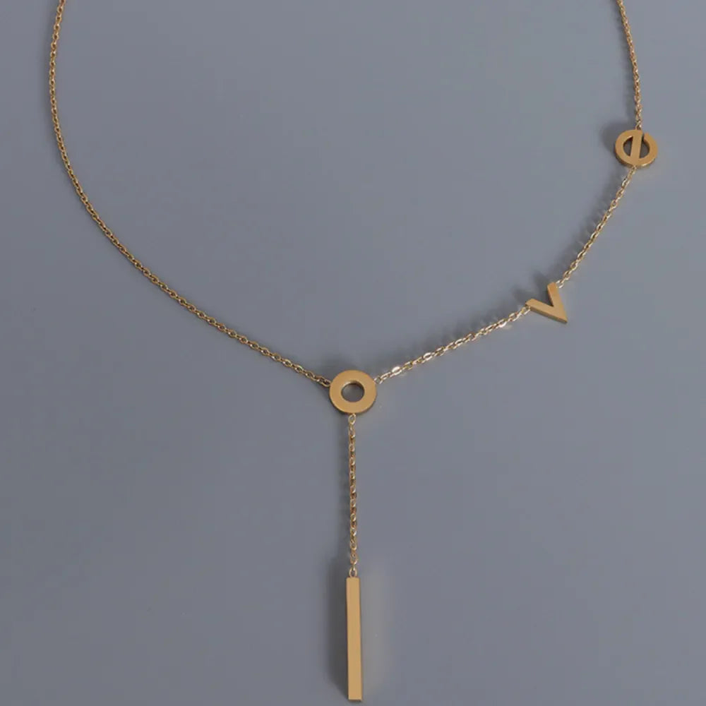 Gold necklace with LOVE letters and a bar pendant, 18K plated.