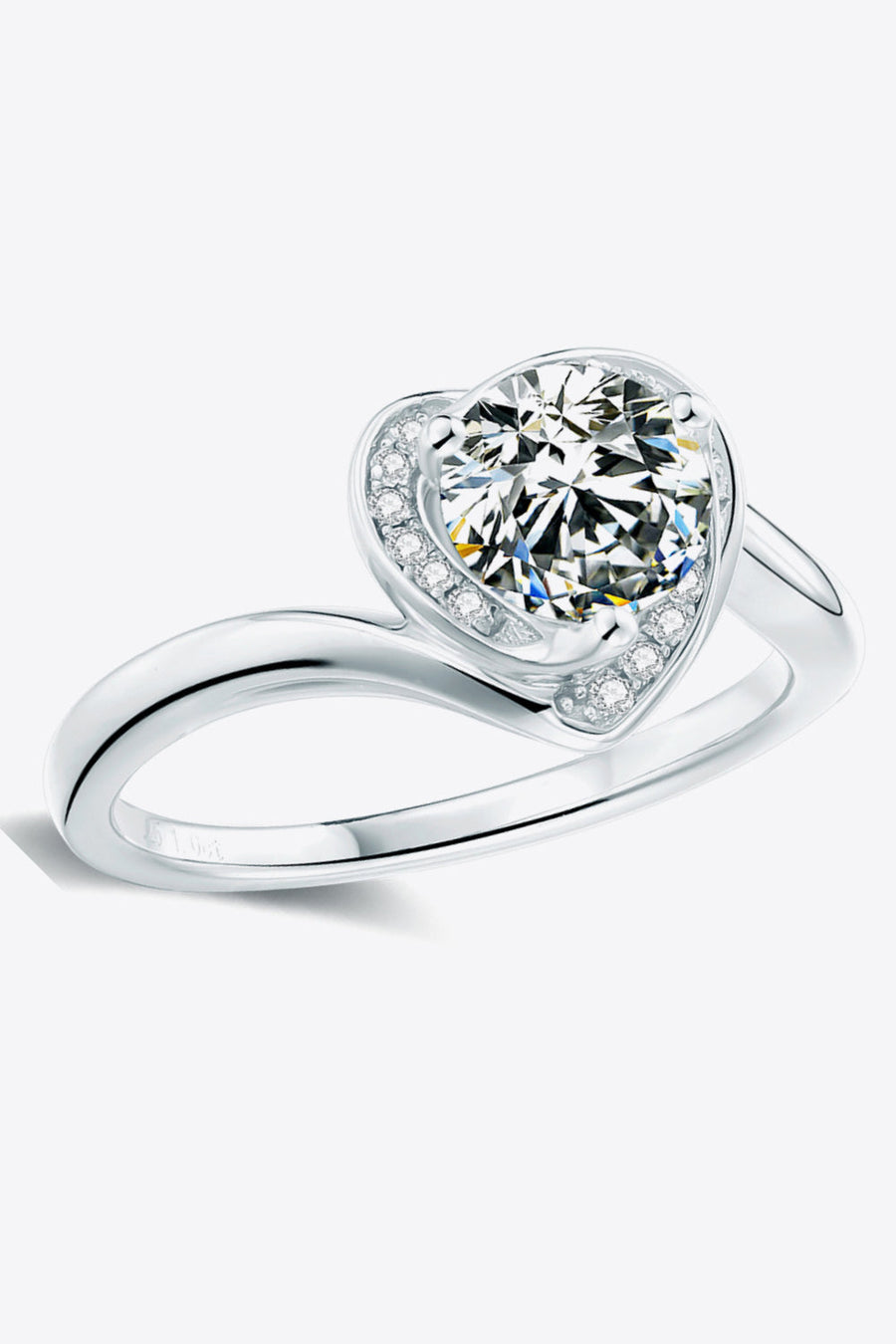 Silver heart halo moissanite ring with a round center stone and pavé accents.
