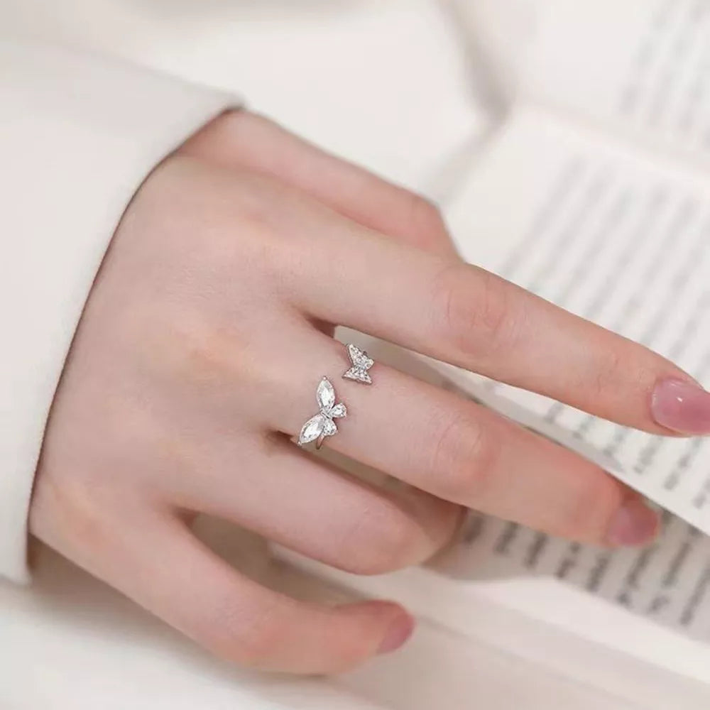 silver ring with butterfly and not applicable