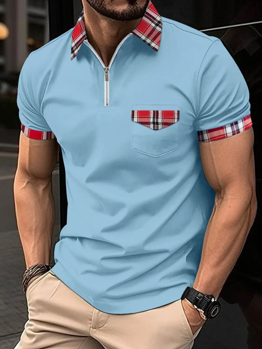 Pastel blue zip polo shirt with plaid trim on collar, pocket, and sleeves.