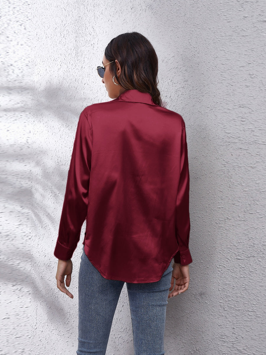 Burgundy silken button-down shirt with a relaxed fit and classic collar.