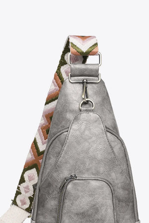 Mid Gray PU sling bag with a patterned strap and zippered pocket.