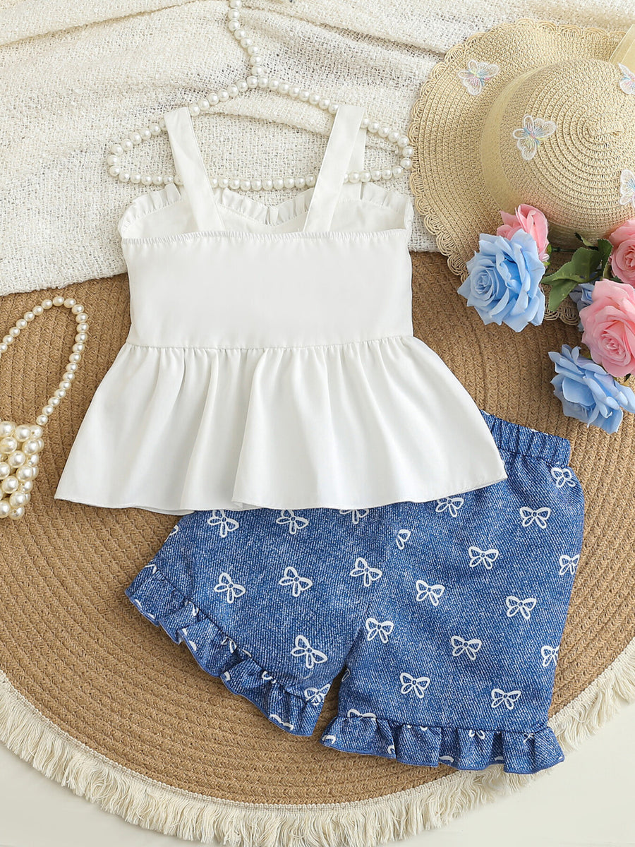 Baby girl white cami and blue bow print shorts set with ruffled hems.