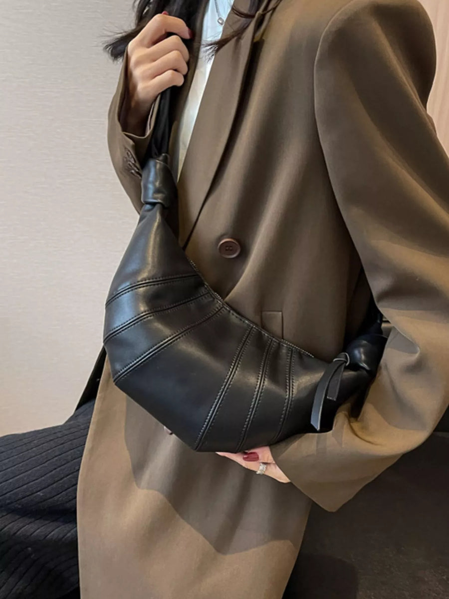 Chic Crescent Hobo Crossbody Bag in black leather with stitched panel detail and knotted strap.