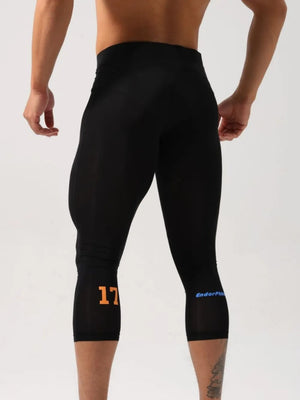 Black compression capri leggings with orange number 17 and blue logo detail