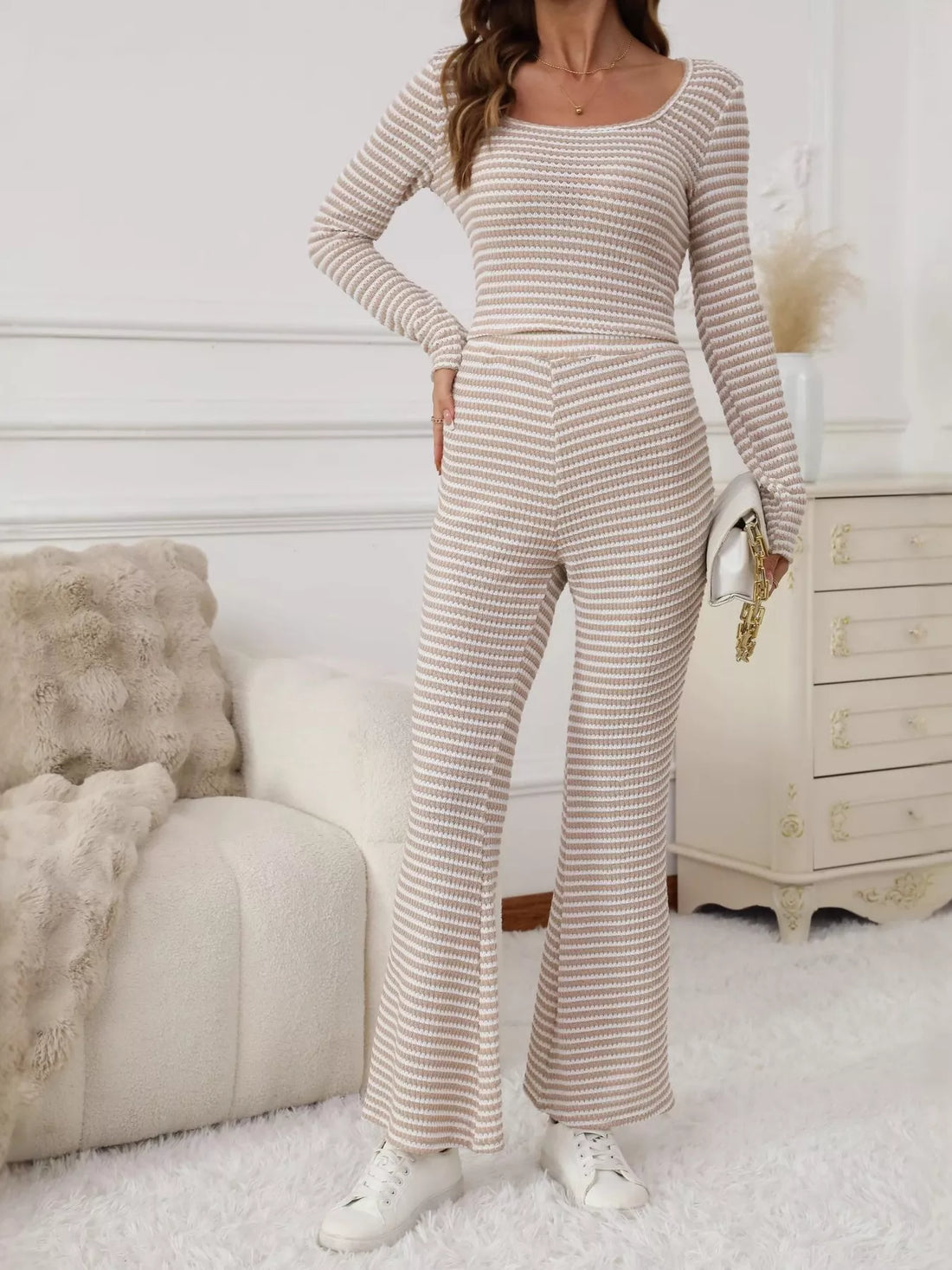 Striped knit top and flare pants set in apricot, featuring a scoop neck and long sleeves.