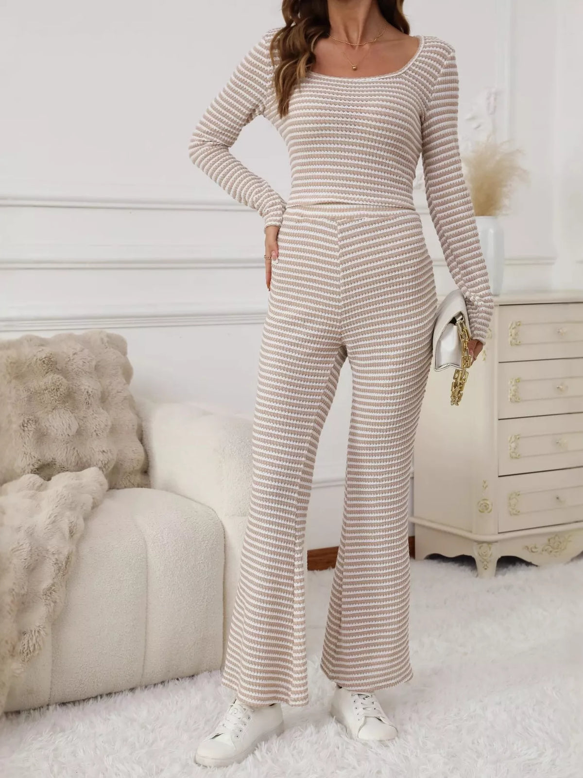 Striped knit top and flare pants set in apricot, featuring a scoop neck and long sleeves.