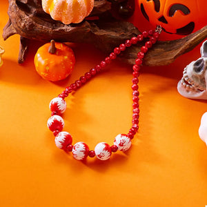red jewelry set with collar length and clasp