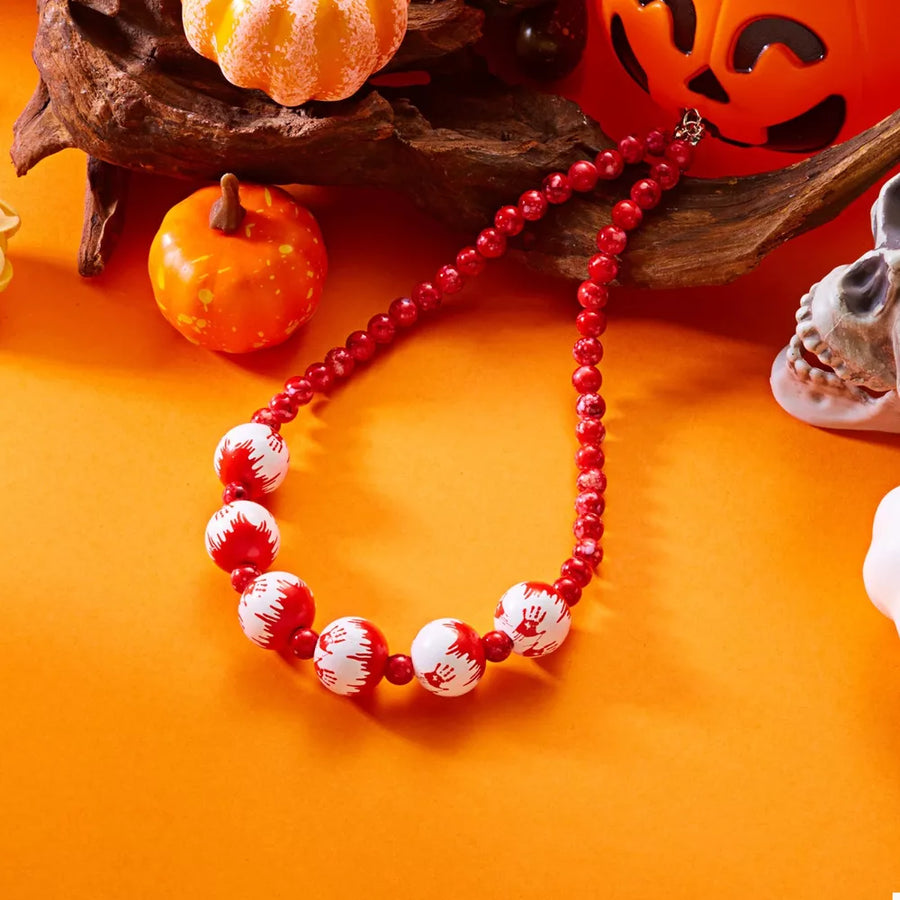 red jewelry set with collar length and clasp