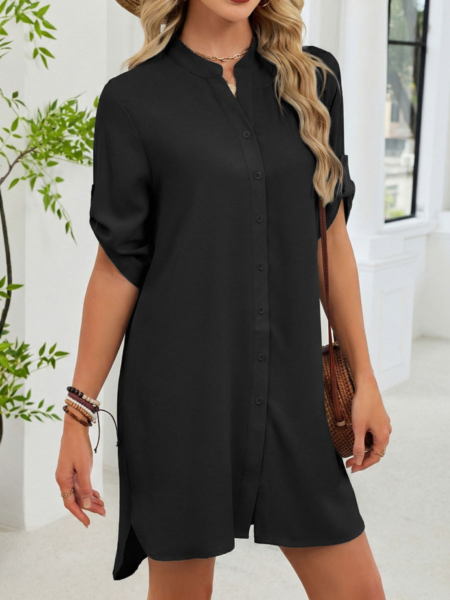 Black button-down shirt dress with band collar and rolled sleeves.