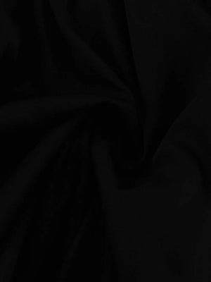 Black fabric with soft folds and a matte finish