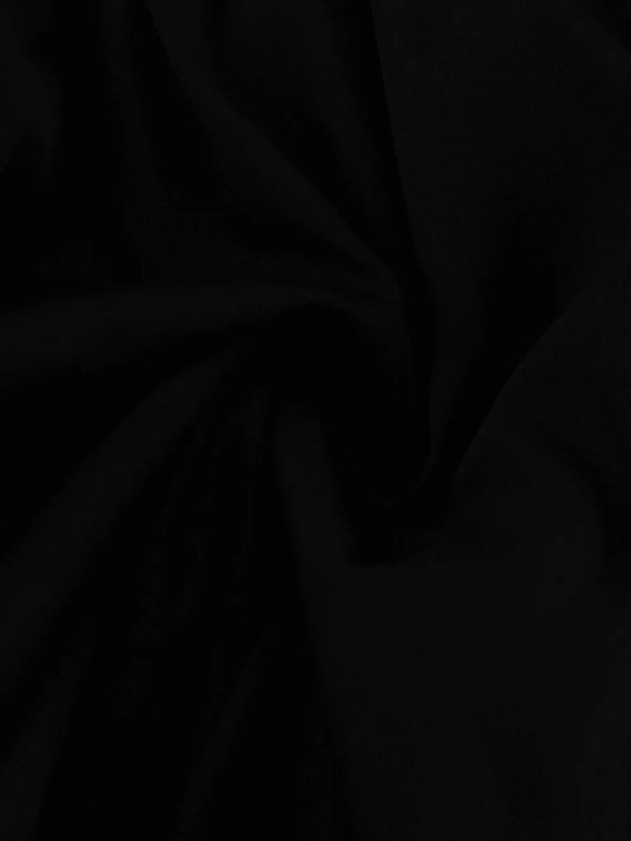 Black fabric with soft folds and a matte finish
