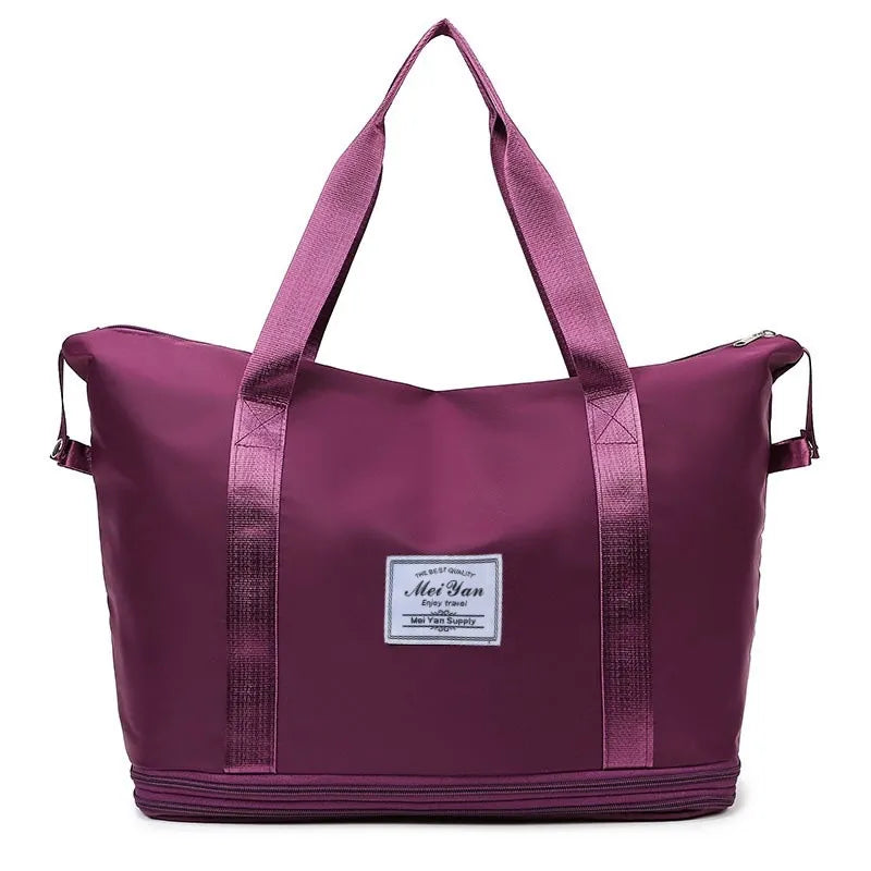 Plum purple travel tote bag with contrast trim and zippered expansion.