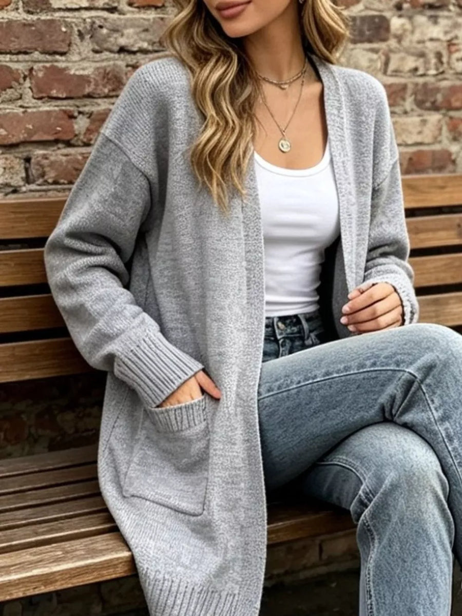 cardigan in light gray featuring pocketed and relaxed fit