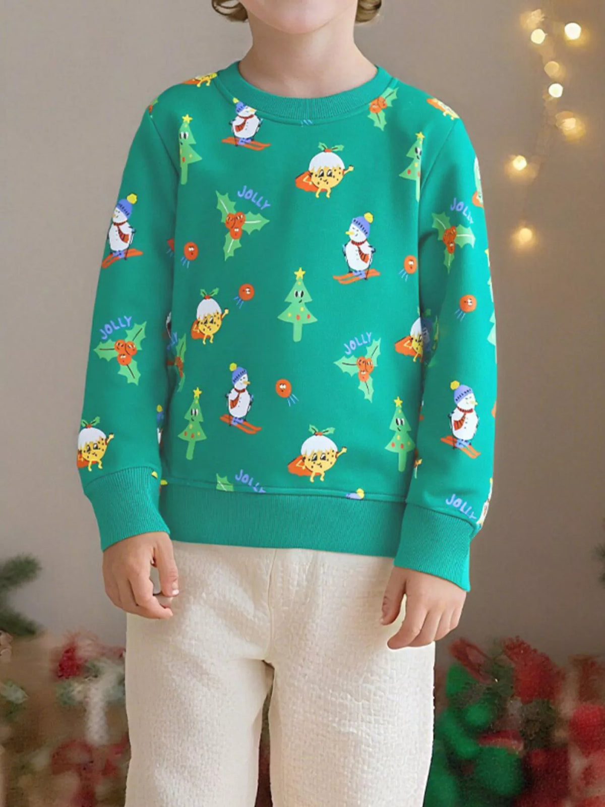 Festive print kids round sweatshirt in turquoise with Christmas characters and trees.